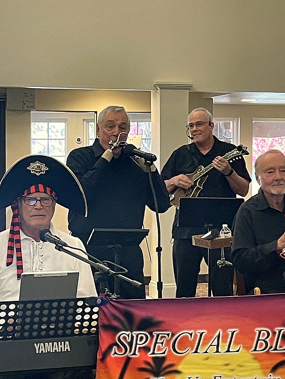 Dave on keyboards, Paul on harmonica, Mayo on percussion, and Dan on mandolin and drums