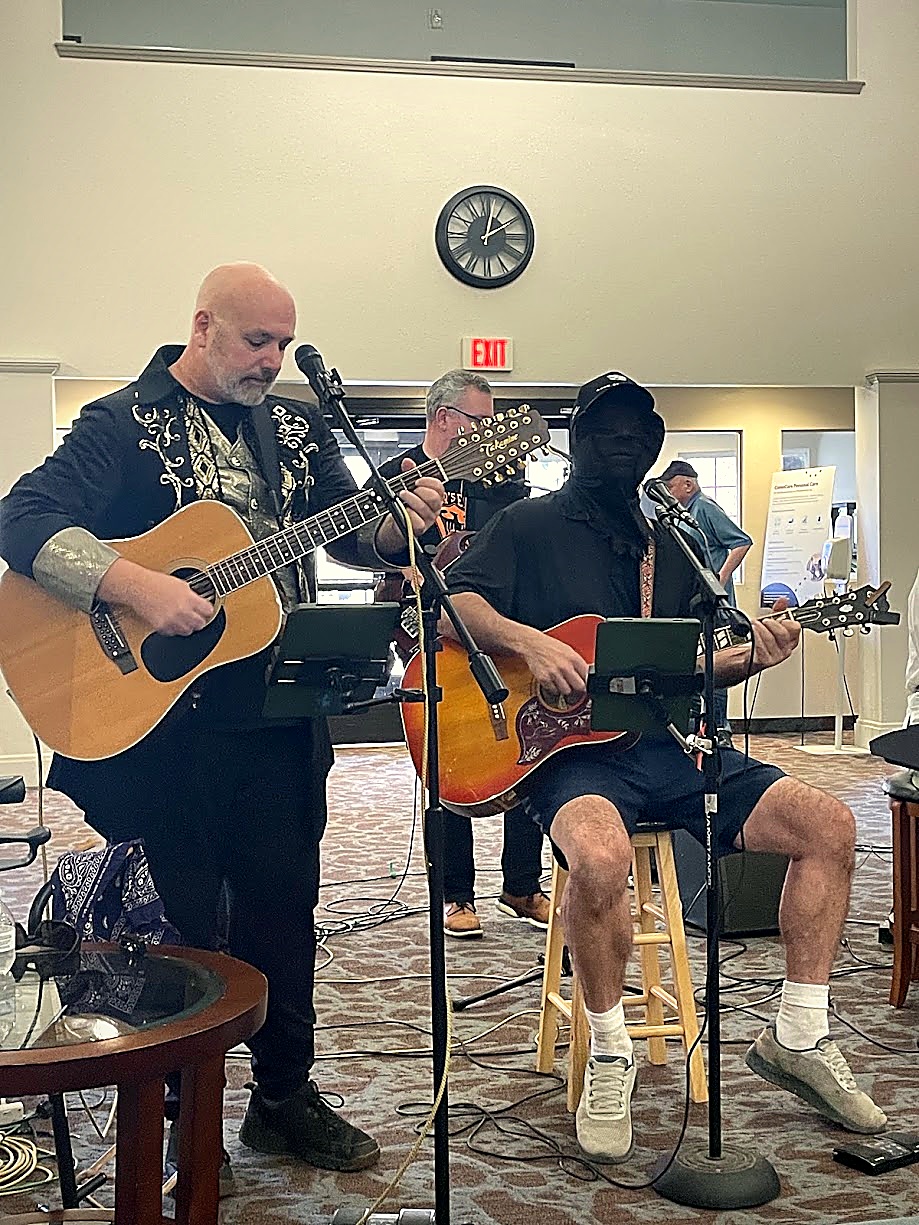 Brian, Rob, and Mike locked into an acoustic and electric guitar harmony groove